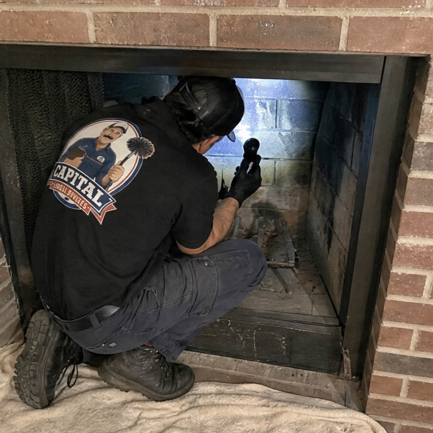 Technician inspecting a fireplace